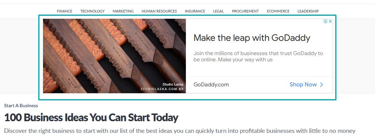 Advertisement for GoDaddy alongside an article titled "100 Business Ideas You Can Start Today"
